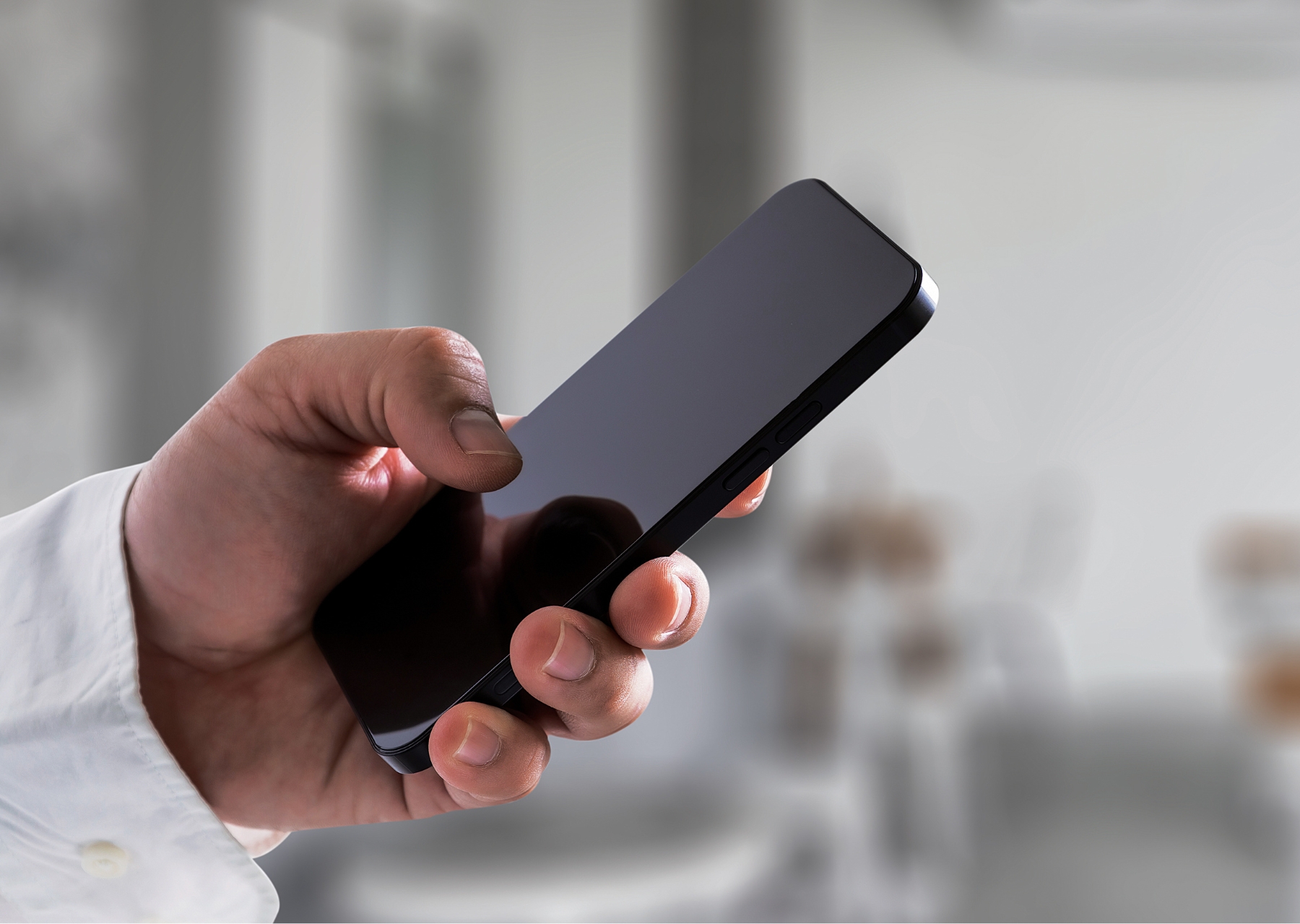man holding cell phone
